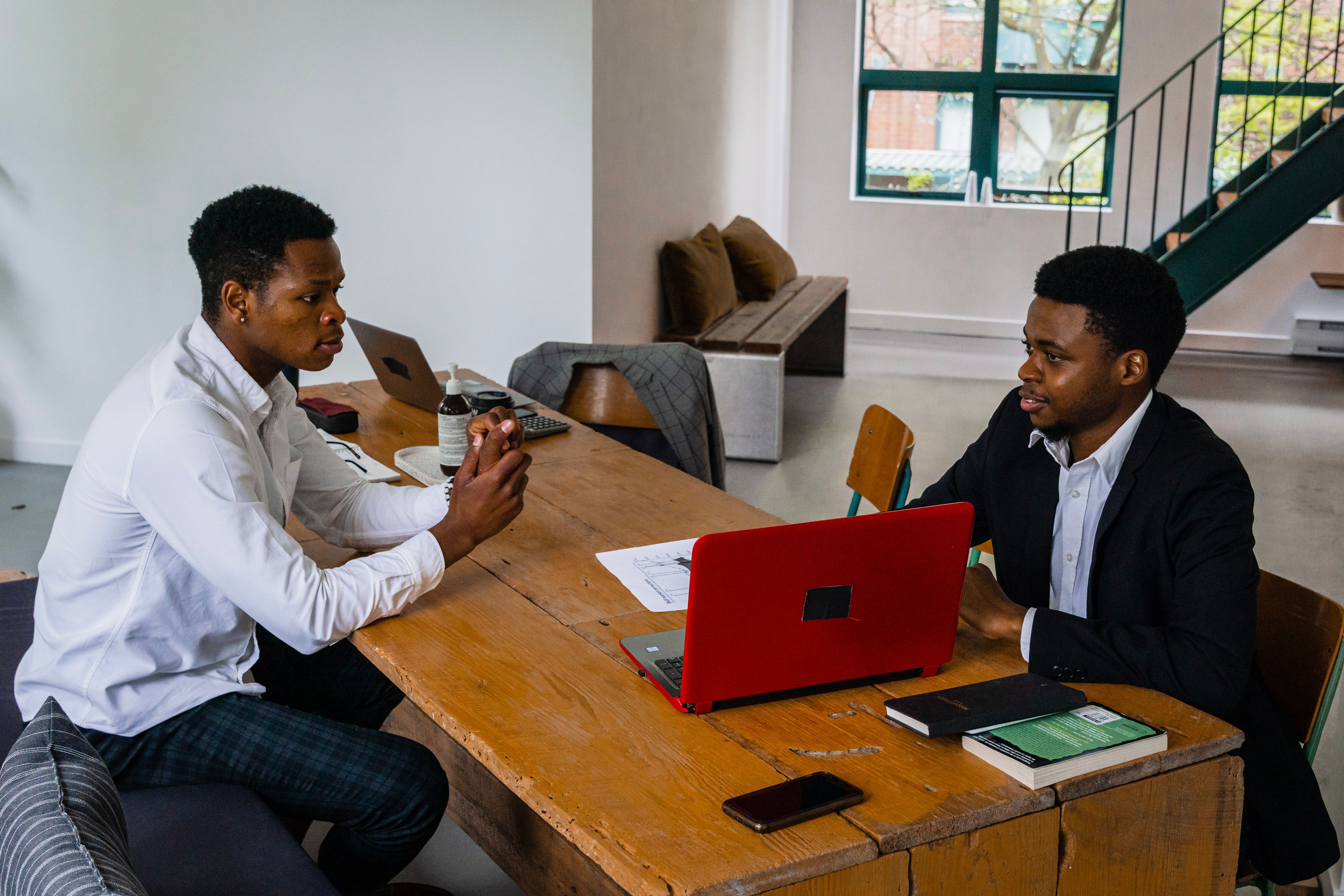 Two founders reviewing a product plan together at a desk